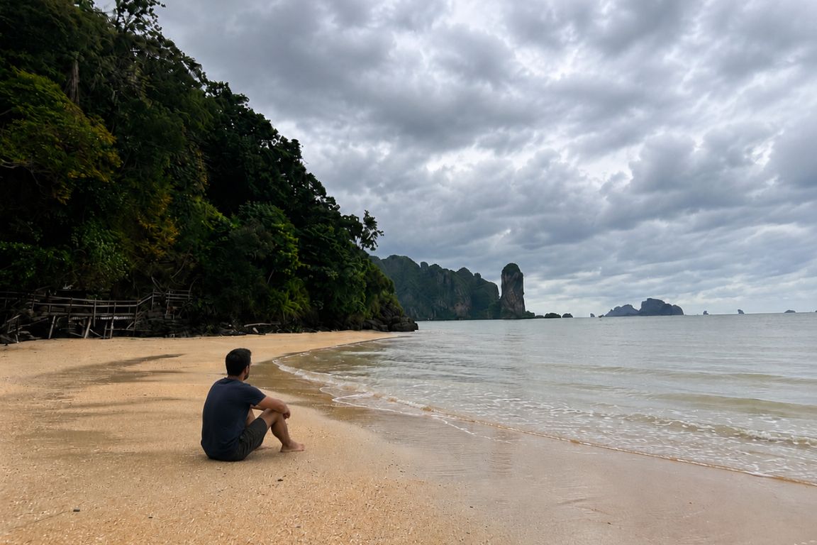 Guest taking in the ocean views from Ao Nang Beach before an island-hopping trip with Krabi Boat Tours in Krabi, Thailand