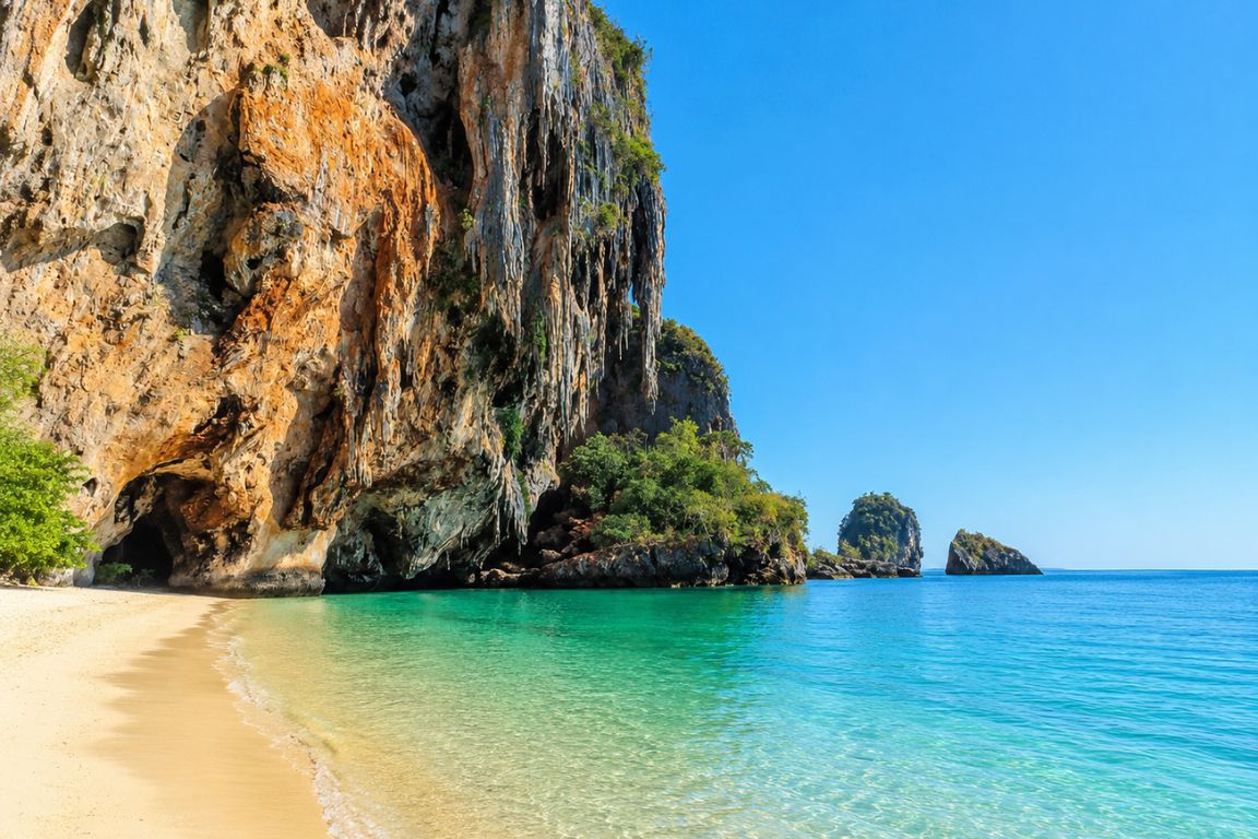 Stunning Phra Nang Cave Beach with crystal-clear Andaman Sea waters and dramatic coastal scenery seen during a Krabi Boat Tours excursion